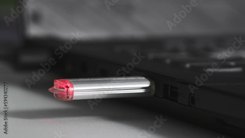 Wallpaper Mural young woman plug usb flash drive into connector on computer, close-up Torontodigital.ca