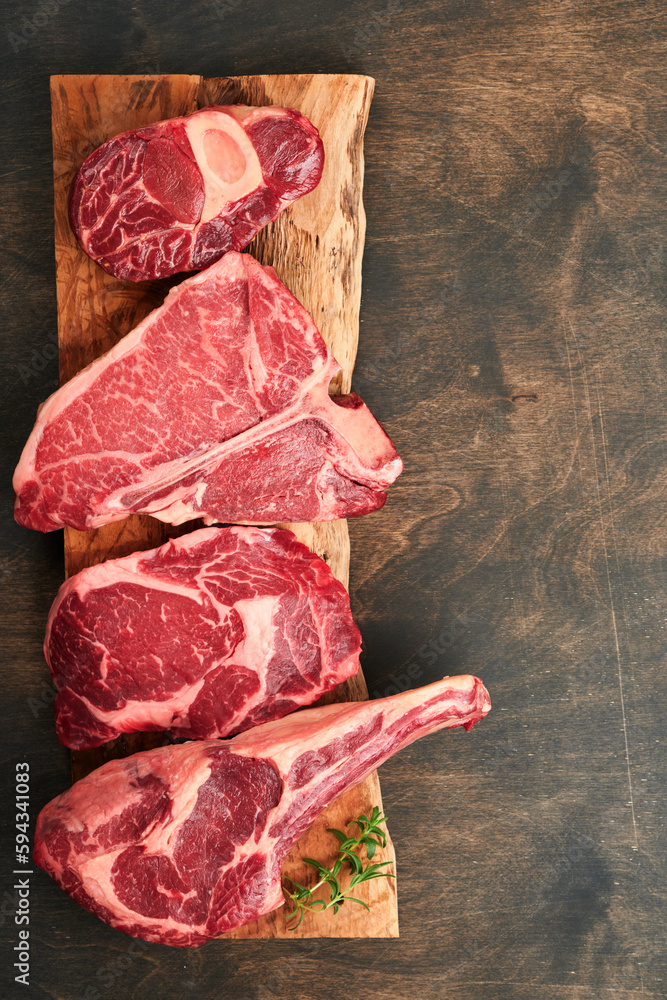 Raw prime steaks. Variety of fresh black angus prime meat steaks Tbone