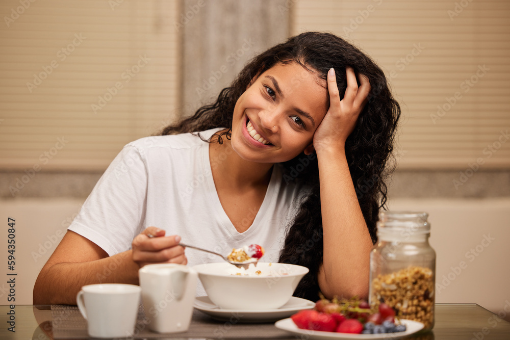 Start your day off with a healthy breakfast. a young woman having breakfast at home. Start your day off with a healthy breakfast. a young woman having breakfast at home.