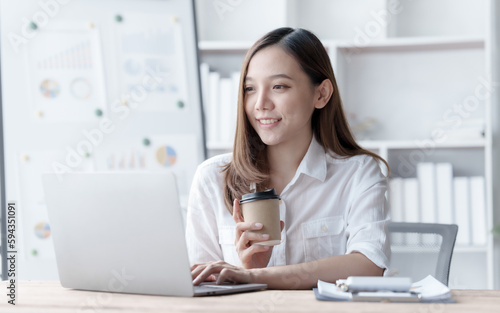 Confident Asian businesswoman calculating finances in the accounting and balance sheet work of the stock market and international exchange rates, Authorized Share Capital, Owners Equity, Common Stock