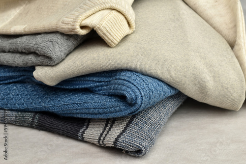 A mountain of warm winter clothes, a sweater, a jumper, taken close-up.