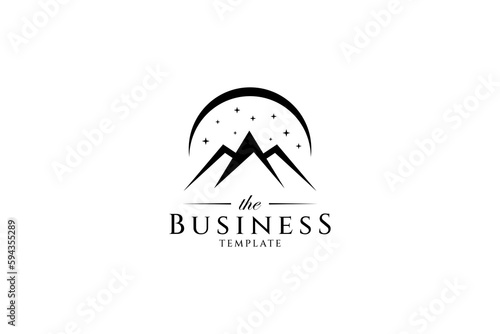 Mountain logo decorated with sparkling stars and crescent moon in flat design style