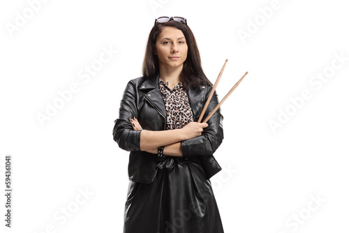 Young female drummer holding a pair of drumsticks