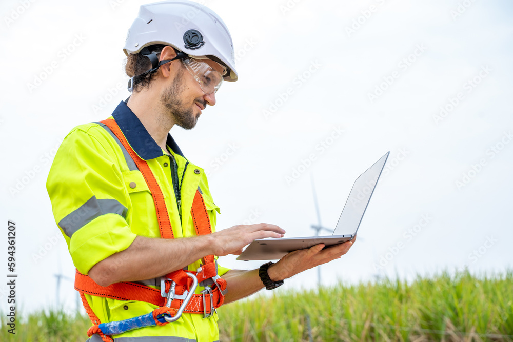 Engineer working at the natural energy wind turbine site,Wind turbine operations that transform wind energy into electrical electricity,Clean energy concept saves the world. Engineer working at the natural energy wind turbine site,Wind turbine operations that transform wind energy into electrical electricity,Clean energy concept saves the world.
