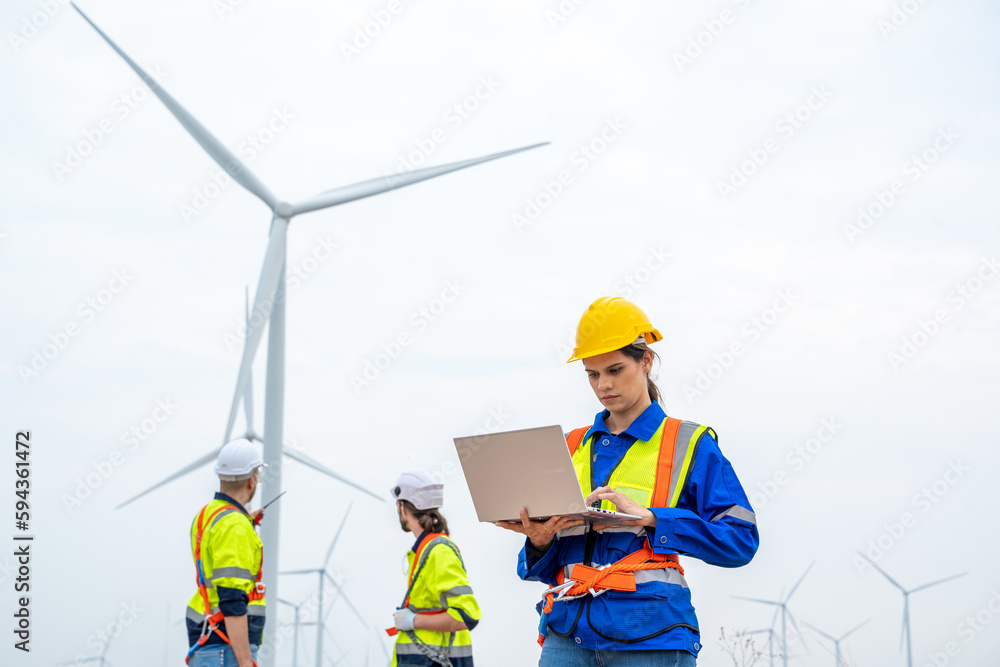 Engineer working at the natural energy wind turbine site,Wind turbine operations that transform wind energy into electrical electricity,Clean energy concept saves the world. Engineer working at the natural energy wind turbine site,Wind turbine operations that transform wind energy into electrical electricity,Clean energy concept saves the world.