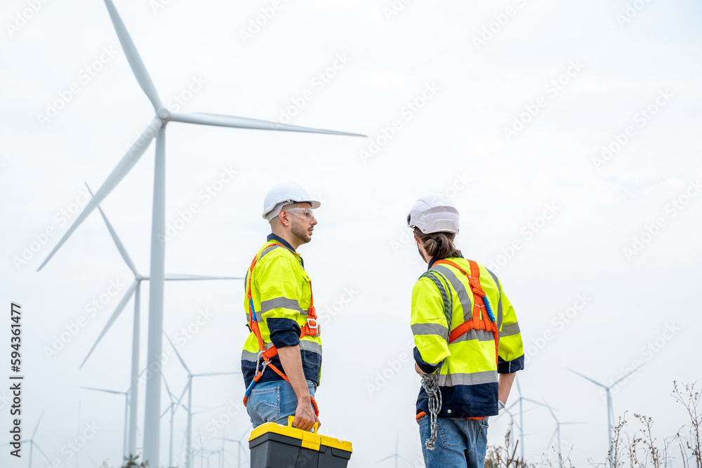 Engineer working at the natural energy wind turbine site,Wind turbine operations that transform wind energy into electrical electricity,Clean energy concept saves the world. Engineer working at the natural energy wind turbine site,Wind turbine operations that transform wind energy into electrical electricity,Clean energy concept saves the world.