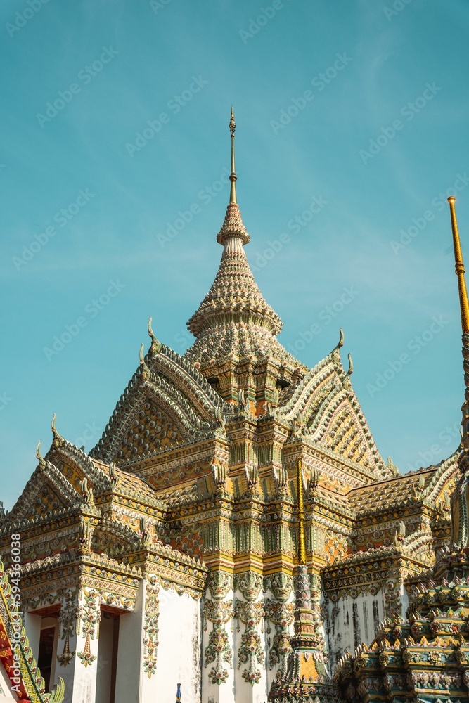 Beautiful ornamental architecture of Wat Pho Buddhist temple in Bangkok, Thailand.