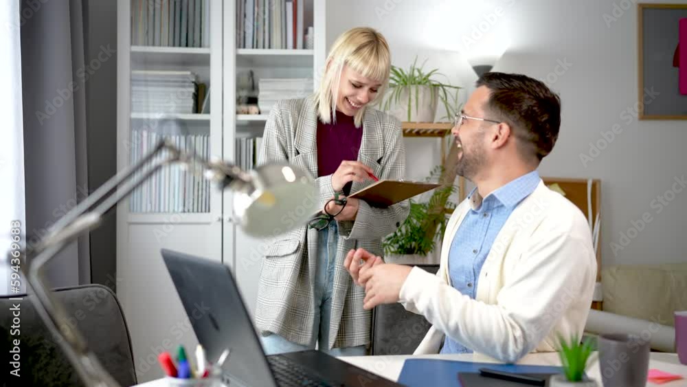 Couple who are managing to balance work and home life efficiently ...