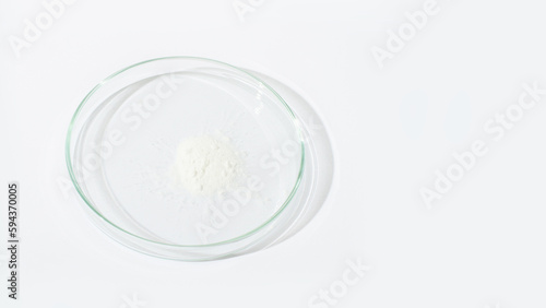 White powder in a Petri dish. Cocaine, cannabinoid, medicinal powder, antibiotic. lab, research.