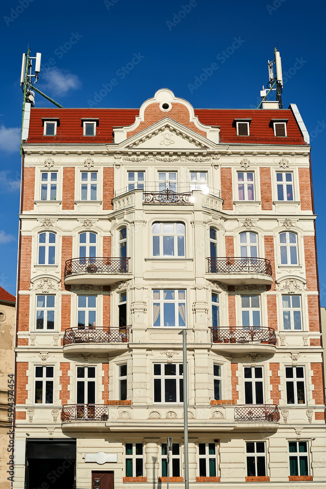 facade of a historic tenement house with balconies in the city of Poznan