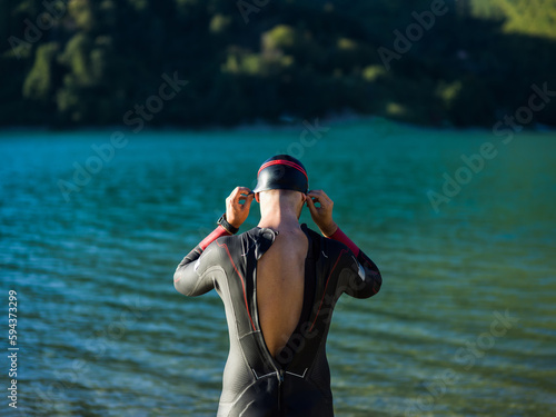 A triathlon swimmer preparing for a river training to gear up for a marathon