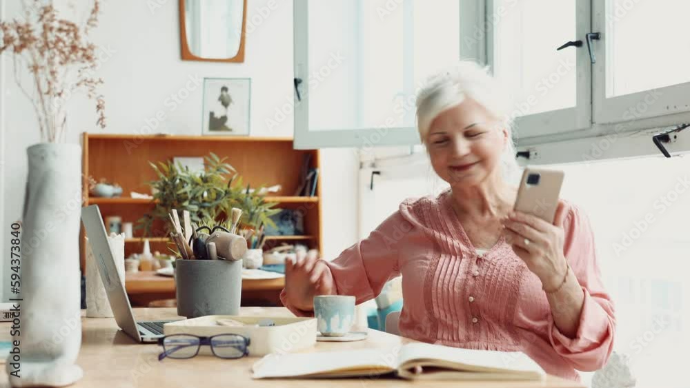 Senior woman using smartphone at home
Senior woman using smartphone at home