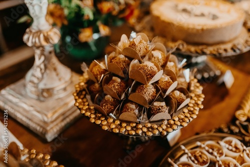 Closeup of a festive table with a pile of sweets during the ceremony