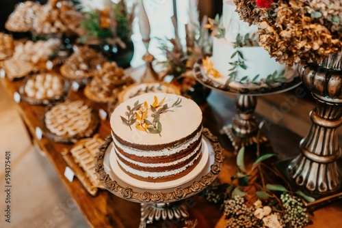 A closeup of a festive table with a variety of sweets and snacks served during the ceremony © Jonathan Borba/Wirestock Creators