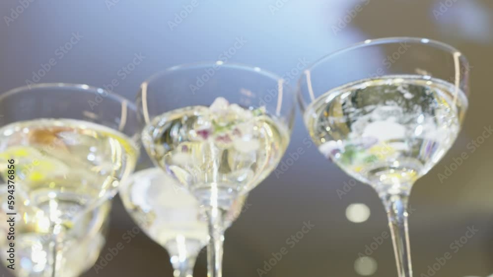 triumph. pyramid of glasses of sparkling wine. shine and sparkle of wine in a glass. flower decoration. festive evening. chic welcome. 4k triumph. pyramid of glasses of sparkling wine. shine and sparkle of wine in a glass. flower decoration. festive evening. chic welcome. 4k