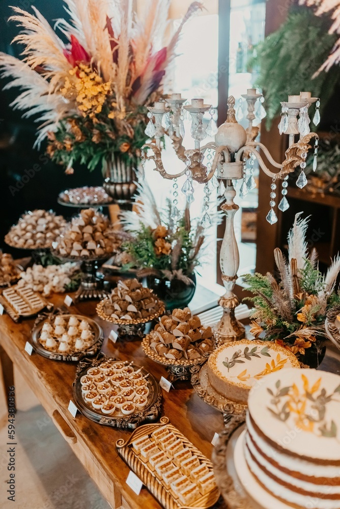 A closeup of a festive table with a variety of sweets and snacks served during the ceremony