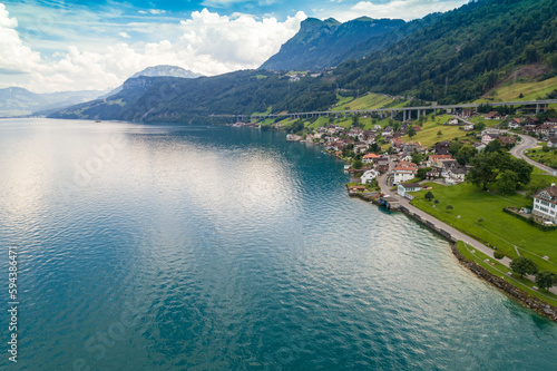 Aerial view of Lucerne lake with a village and green mountains, Lucern, Switzerland