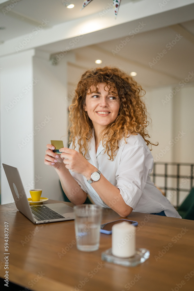 Woman happy caucasian female shopping online use credit card at cafe Woman happy caucasian female shopping online use credit card at cafe