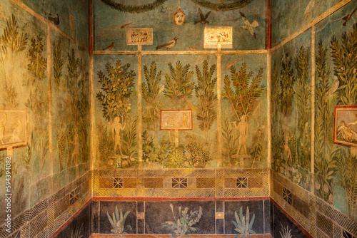 Ancient fresco on a wall of villa in Pompeii archaeological park near Naples city, Italy
