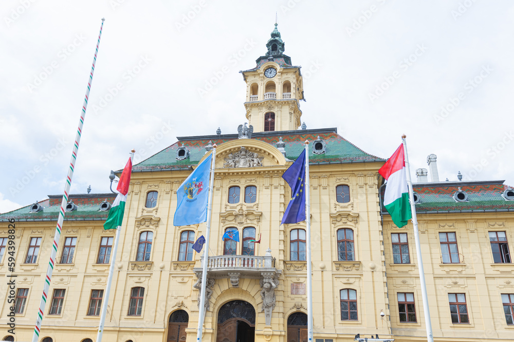 Vintage town hall building stands tall and proud in the heart of Szeged, Hungary - a picturesque cityscape full of history and culture.