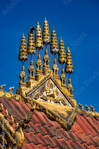 Vertical shot of a temple roof design in Wat Phiawat, Xiangkhouang, Laos photo