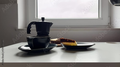  women's hands taking a cup of coffee on the table Geyser coffee maker. Coffee break concept, fika.