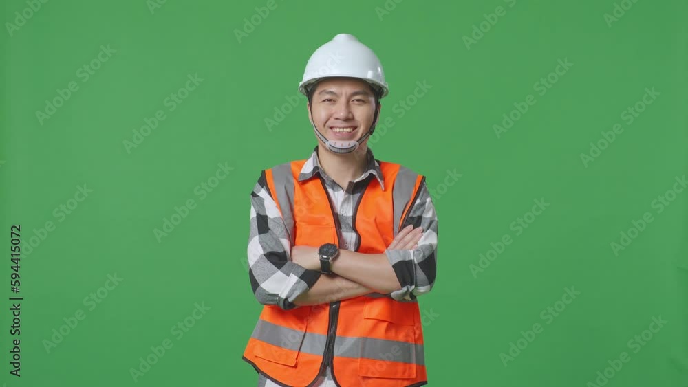 Asian Male Engineer With Safety Helmet Crossing His Arms And Smiling To Camera While Standing In The Green Screen Background Studio
Asian Male Engineer With Safety Helmet Crossing His Arms And Smiling To Camera While Standing In The Green Screen Background Studio