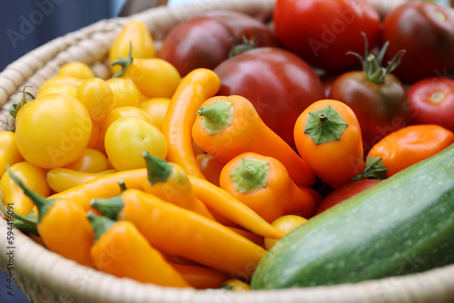 Closeup basket of vegetables home grown pepper tomatoes pepperoni vegan vegetarian food eco clean vegetation colorful items soft focus macro shot