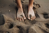 Gros plan sur des pieds dans le sable mouillé d'une plage » IA générative