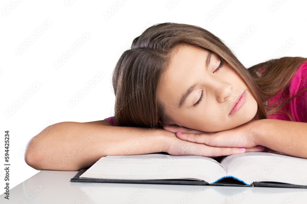 Schoolgirl sleeping on school book. Isolated on white background Schoolgirl sleeping on school book. Isolated on white background