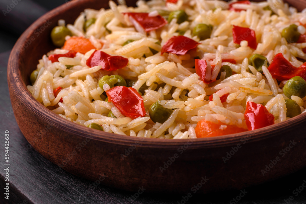 Delicious boiled rice with vegetables peppers, carrots, peas and asparagus beans Delicious boiled rice with vegetables peppers, carrots, peas and asparagus beans