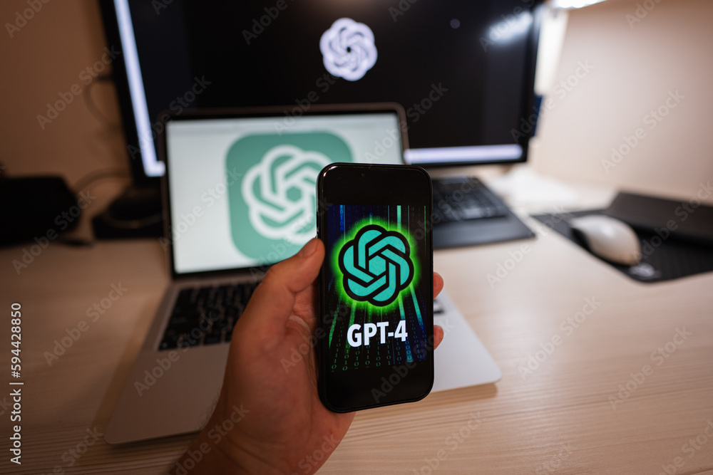 Kyiv, Ukraine - April, 2023: Hold smartphone with OpenAI GPT-4. Photos