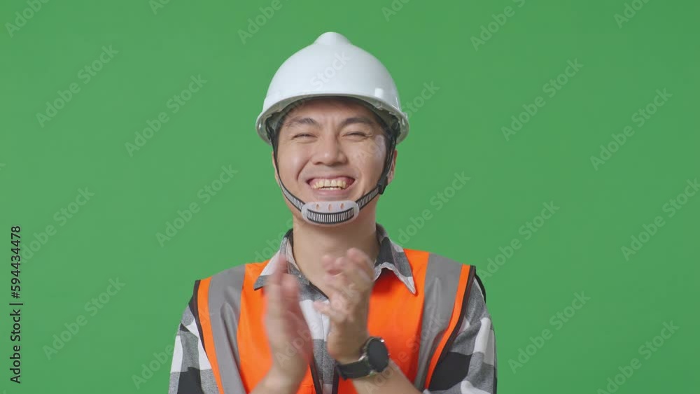 Close Up Of Asian Male Engineer With Safety Helmet Smiling And Clapping His Hands While Standing In The Green Screen Background Studio
Close Up Of Asian Male Engineer With Safety Helmet Smiling And Clapping His Hands While Standing In The Green Screen Background Studio