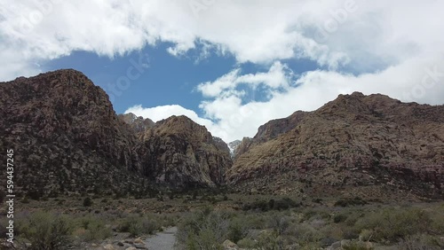 Still camera of red rocks and sandstone mountains in Red Rock Canyon, Nevada on a Sunny Day