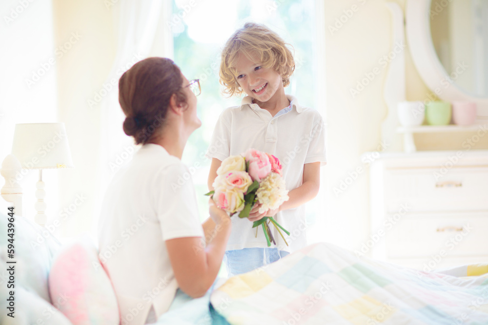 Child giving mom present. Mother’s day gift. Child giving mom present. Mother’s day gift.