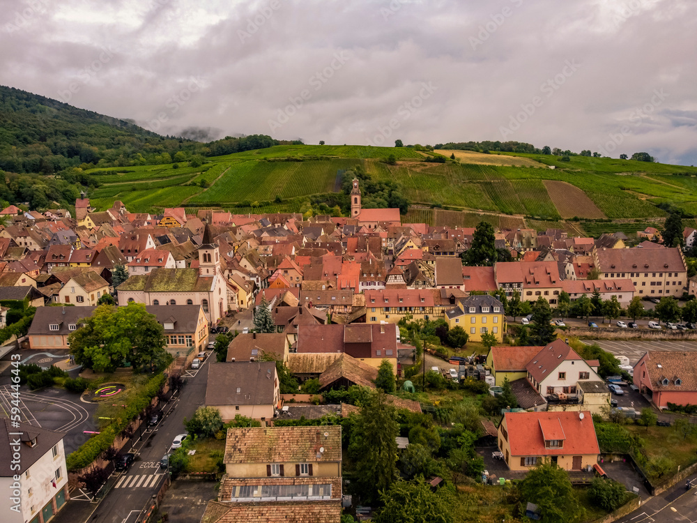 Aerial vIew by drone. Summer. France, Alsace. Riquewihr fortess town.
