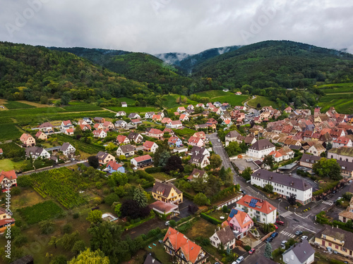 Aerial vIew by drone. Summer. France, Alsace. Riquewihr fortess town.
