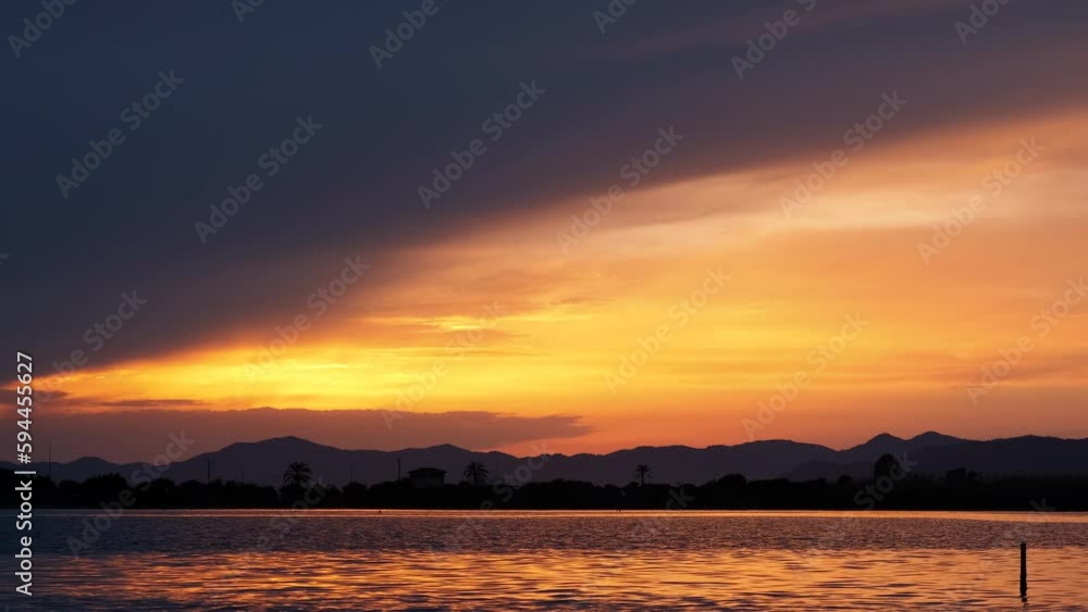 Calm lake waves against pink sky. A nice calm empty bay silhouette by river waves during nightfall. Calm lake waves against pink sky. A nice calm empty bay silhouette by river waves during nightfall.