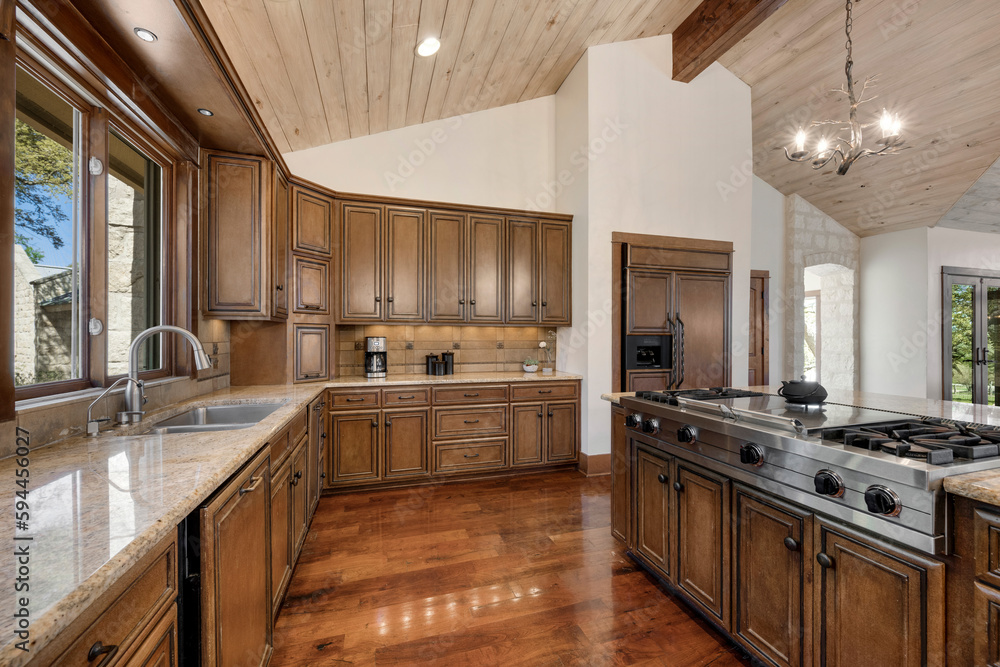 Fototapeta premium a farmhouse kitchen with wood floors and accents