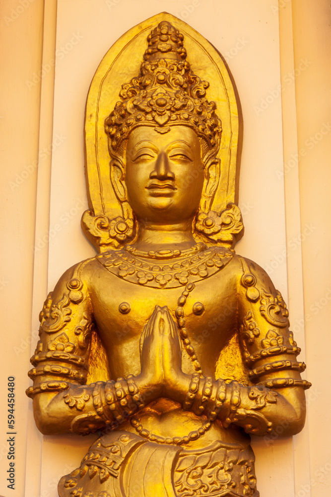 Chiang Mai, Thailand. Wat Phan On. Buddha statue wall decoration.