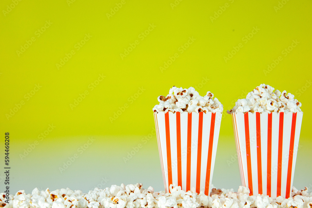 front view fresh popcorn in white and red striped packages on light green background snack cinema cips color photo corn movie free place