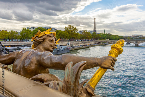 Paris. Nymphes de la Seine statue on Pont Alexandre III, along River Seine. Distant Eiffel Tower. © Danita Delimont