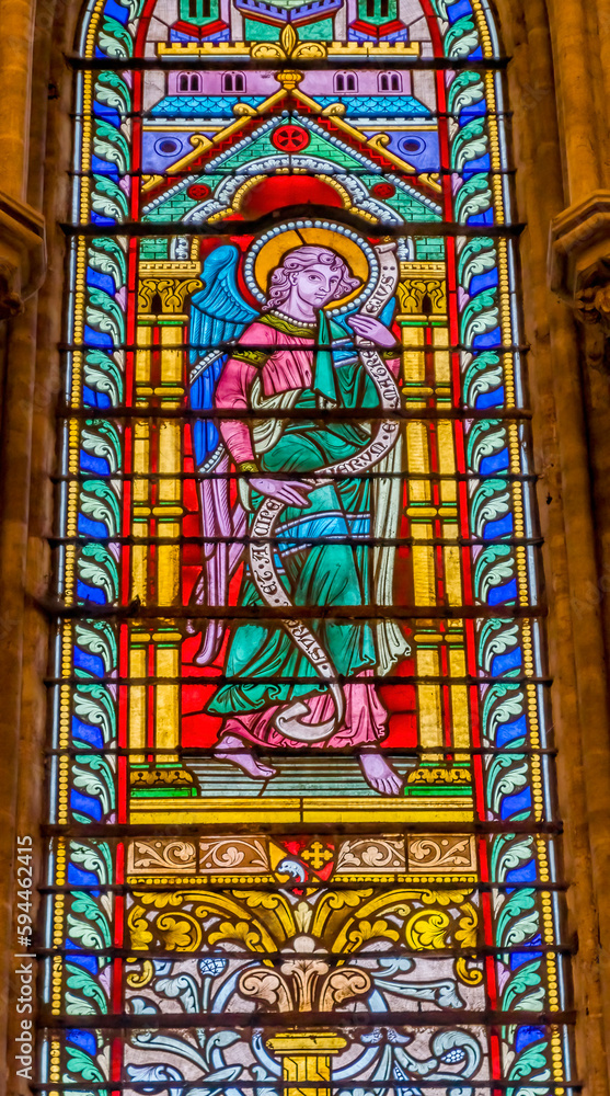 Colorful angel stained glass, Bayeux Cathedral, Bayeux, Normandy, France. Catholic church consecrated by King William the Conqueror in 1077
