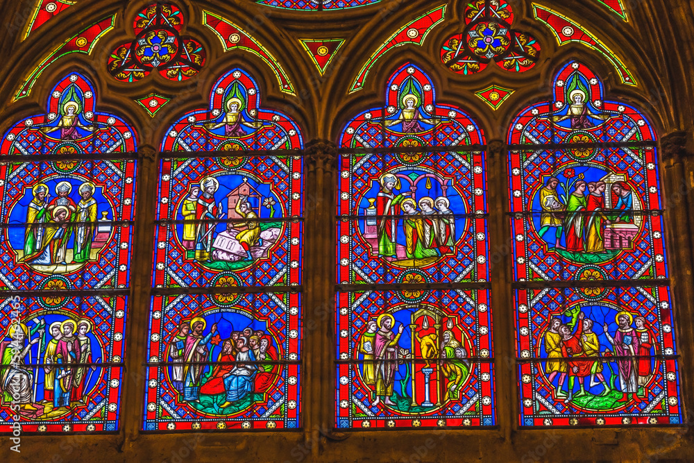 Colorful medieval stained glass, Bayeux Cathedral, Bayeux, Normandy, France. Catholic church consecrated in 1077