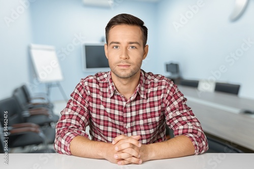Young confident man in modern office
