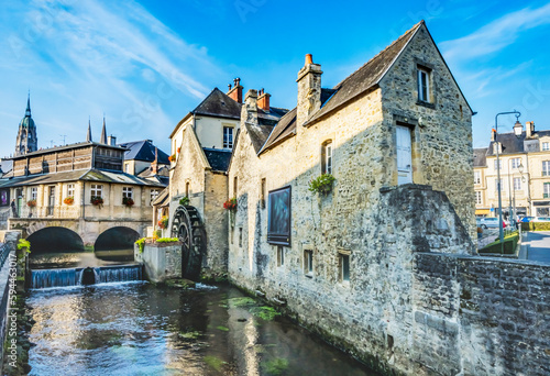 Colorful old buildings, Aure River reflection, Bayeux, Normandy, France. Bayeux founded 1st century BC, first city liberated after D-Day