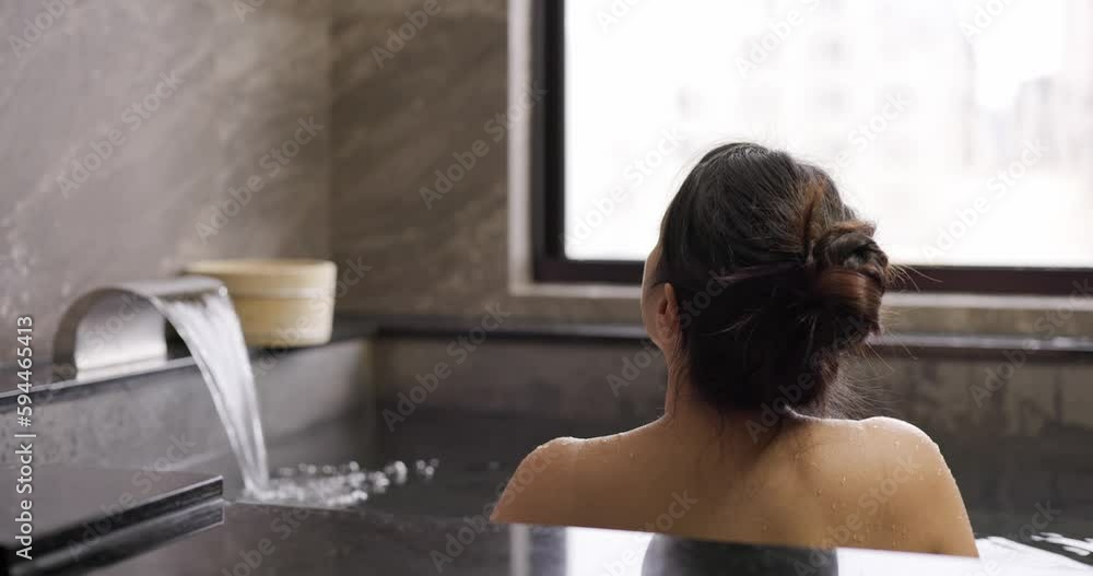 Woman enjoy Japanese onsen at resort Woman enjoy Japanese onsen at resort
