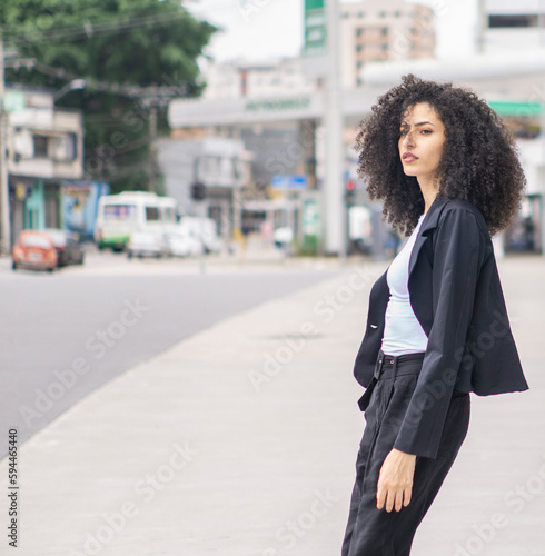 white curly brazilian business woman empowered executive 