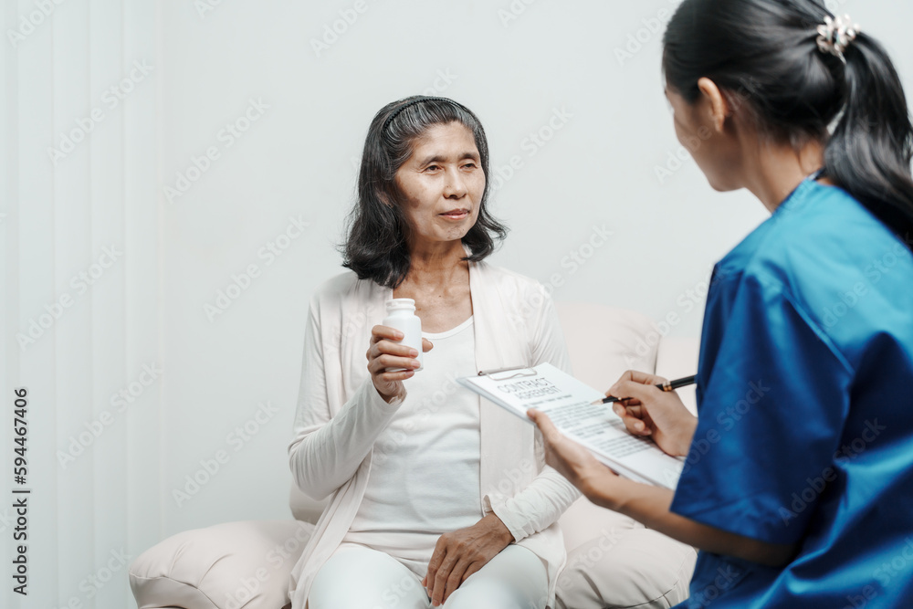 Senior older elderly patient asian grandmother woman with nurse consulting, safety and support of help, trust of breast cancer awareness, encourage Senior older elderly patient asian grandmother woman with nurse consulting, safety and support of help, trust of breast cancer awareness, encourage