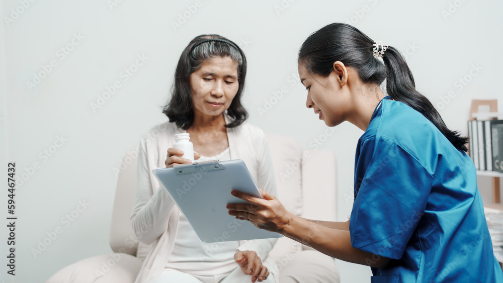Senior older elderly patient asian grandmother woman with nurse consulting, safety and support of help, trust of breast cancer awareness, encourage